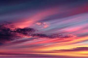 Fototapeta premium Defocused sunset sky background with blurred panning motion.