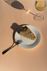 Piece of cake on a plate outdoor on a sunny day