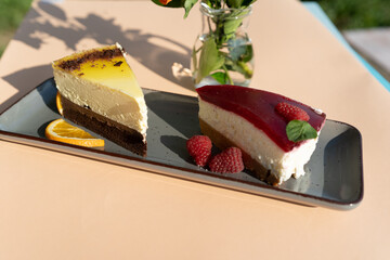 Piece of cake on a plate outdoor on a sunny day