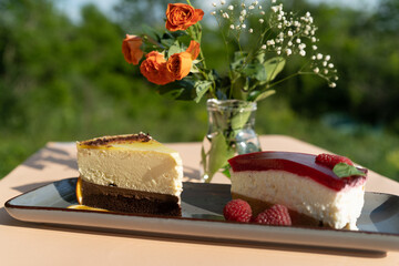 Piece of cake on a plate outdoor on a sunny day