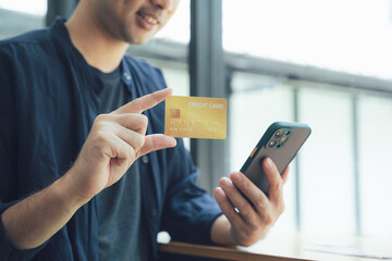 Man Using Credit Card for Mobile Payment