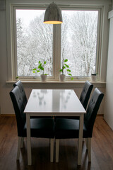 Minimalist Dining Area with Winter Window View – Scandinavian Interior Design