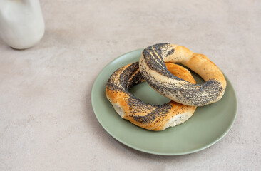 bagels on a plate on a stone board