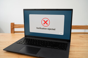 Verification rejected message on laptop screen. Concept of bad results on background check.