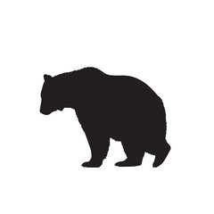 Fototapeta premium Black silhouette of a bear walking sideways
