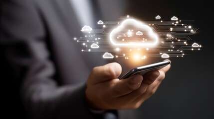 Businessman’s Hand Holding Smartphone with Holographic Cloud Interface – Highlighting Seamless Cloud Connection, Data Access, and Futuristic Digital Networking in a Sleek Tech Environment