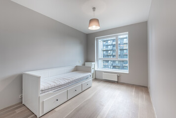 Minimalistic Home Bedroom Interior with Gray Walls and a White Single Bed Frame