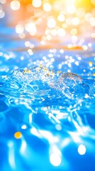 Shimmering water surface with out-of-focus warm-toned bokeh lights in the background, suggesting a sunny, possibly tropical, setting.  The water is a vibrant blue with ripples and small splashes