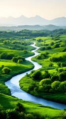 Serpentine river meanders through lush green valley, nestled amidst rolling hills and distant, hazy mountains under a soft, light sky