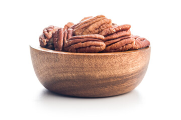 Peeled pecan nuts in bowl isolated on white background.