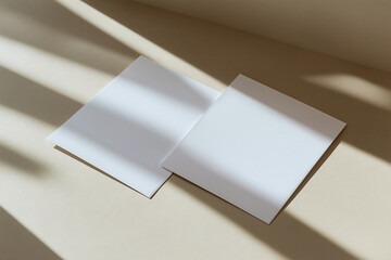Creative arrangement of blank sheets inviting inspiration in sunlight