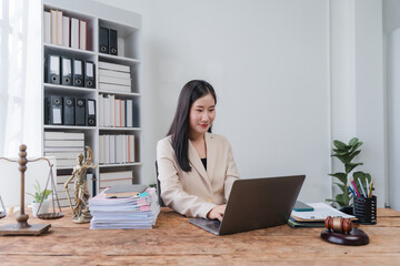 Asian Female Lawyer Working at Desk