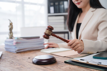 Female Lawyer Holding Gavel in Office