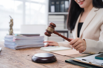 Female Lawyer Holding Gavel in Office