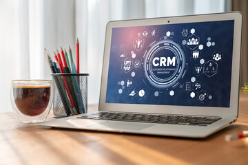 Naklejka premium Customer relationship management system on modish computer for CRM business and enterprise