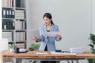 Asian Businesswoman Working at Desk