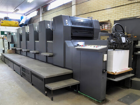 Lithograph printing machine in a factory manufacturing print shop business, stock photo image