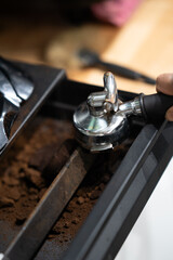  coffee grounds container, close-up, isolated in barista workspace.