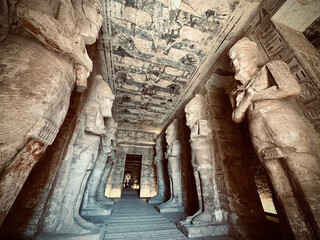 Interior view with giant statues of Ramses II Abu Simbel temple, ancient Egypt