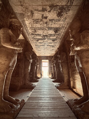 Interior view with giant statues of Ramses II Abu Simbel temple, ancient Egypt