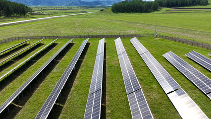 Solar power plant in the mountains. Thousands of solar panels. Renewable energy in remote...