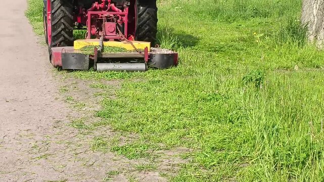  the tractor removes excess grass