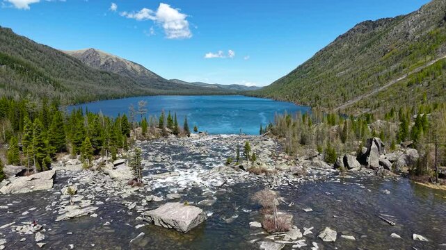 Multinsky lakes of the Altai Republic. Beautiful high-mountain lakes surrounded by mountains, cinematic 4k views from a great height.