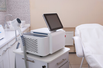 Laser hair removal machine and medical couch in beauty salon
