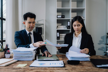 Business Professionals Reviewing Documents in Office