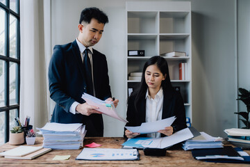 Business Professionals Reviewing Documents in Office