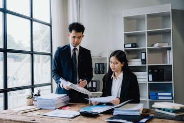 Business Professionals Reviewing Documents in Office