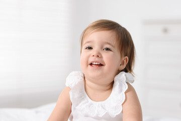 Portrait of cute little baby girl at home