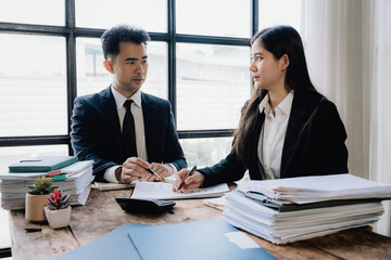 Business Professionals Discussing Documents in Office