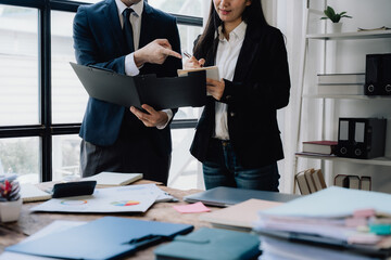 Business Team Discussing Documents in Office