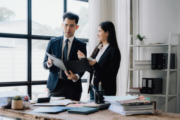 Business Professionals Reviewing Documents in Office