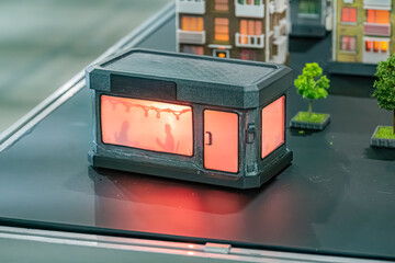 Miniature model street scene with glowing building, varying architectural styles, cityscape...