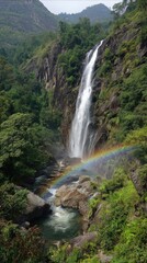 Waterfall cascades with vibrant rainbow in nature