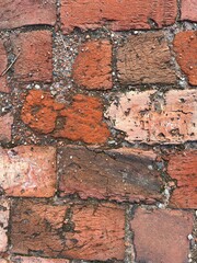 red brick background, red tile path
