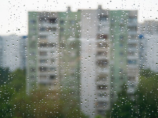 Rain water drops on window glass abstract backdrop