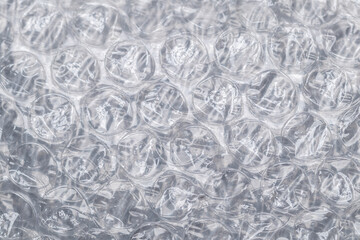 Bubble wrap macro photo with selective focus. It is a pliable transparent plastic material with...