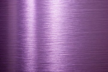 Close-up of a purple metallic textured surface with smooth light reflections and a brushed finish.