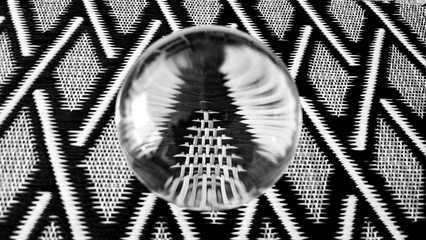 Glass sphere over geometric pattern