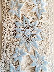 Intricate lace fabric featuring delicate blue floral embroidery with detailed stitching, showcasing craftsmanship and artistry in textile design and decorative elements
