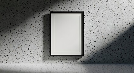 Frame on speckled wall