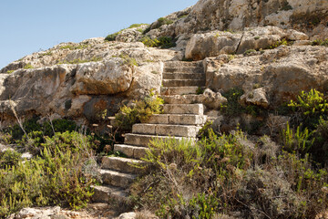 Ancient Stone Steps Ascending Rocky Maltese Coastline Landscape