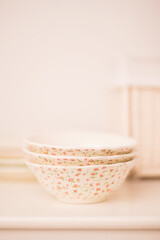 Closeup of porcelain plates and bowls