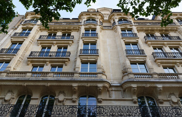 Paris, typical facades and windows, beautiful buildings, with old zinc roofs
