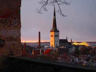 Panoramic view of the city skyline of the old town of Tallinn, Estonia. The spire of St. Olaf's...