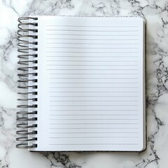 A blank spiral notebook with lined pages on a marble surface, ideal for writing, note-taking, or journaling in a modern workspace.