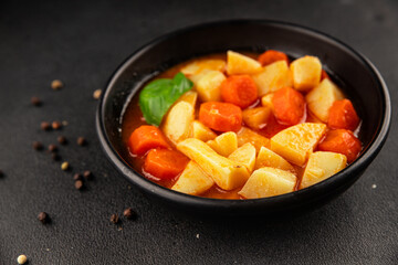 Stewed potatoes with carrots vegetarian side dish fresh delicious gourmet food background on the table rustic food top view copy space keto and paleo diet vegan food